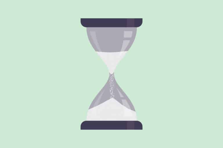 An hourglass on a green background