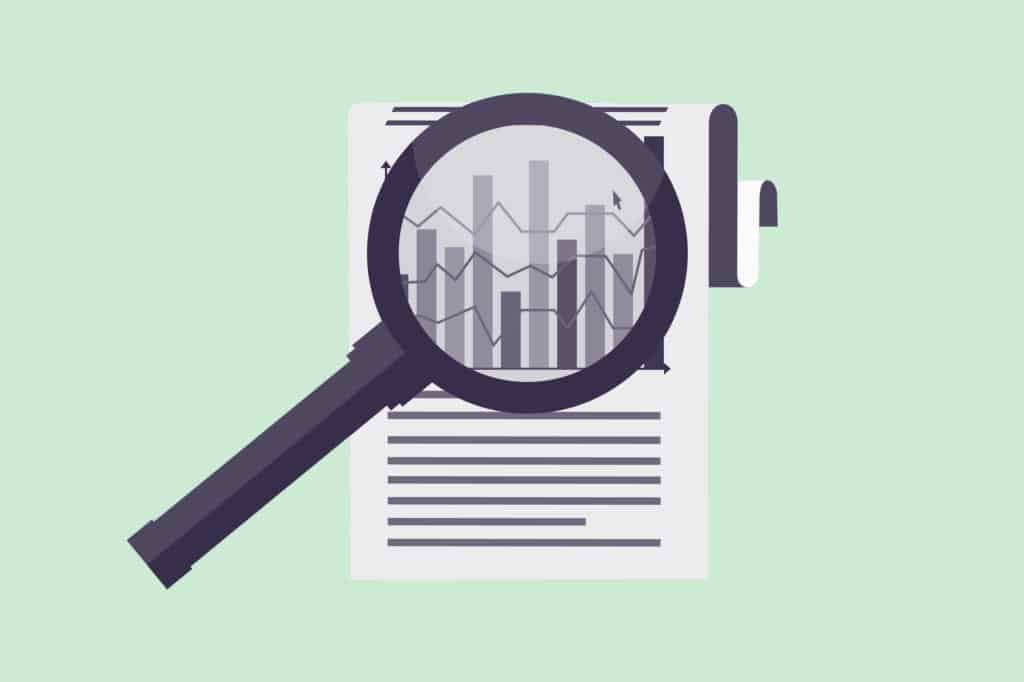 A business report with magnifying glass on it on a green background