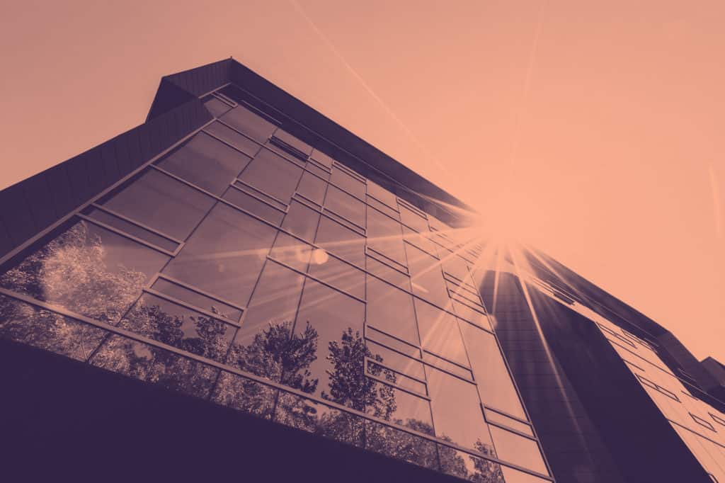 A view of a building facade during sunset