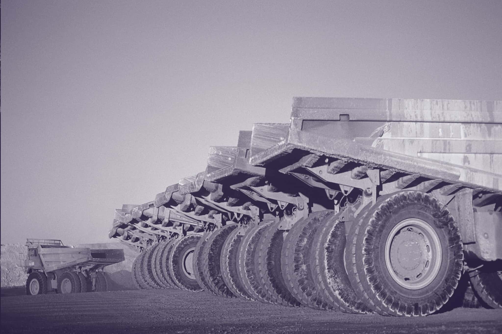 mining trucks lined up in a row