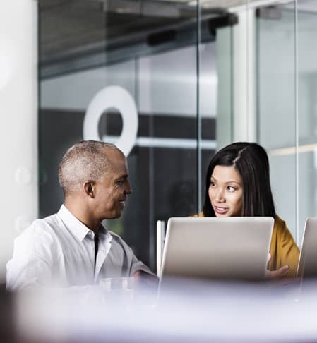 A woman explaining something to a colleague