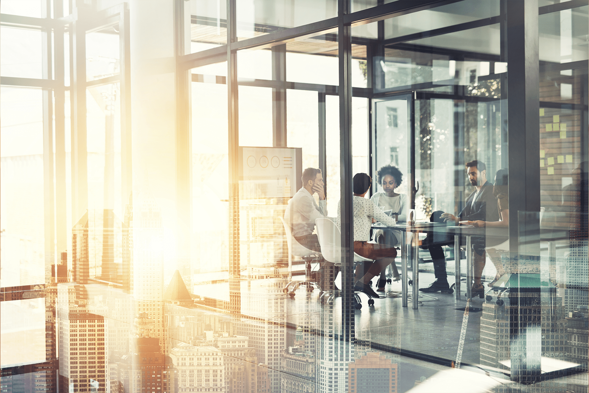 Group of people having a meeting inside a glass-walled room