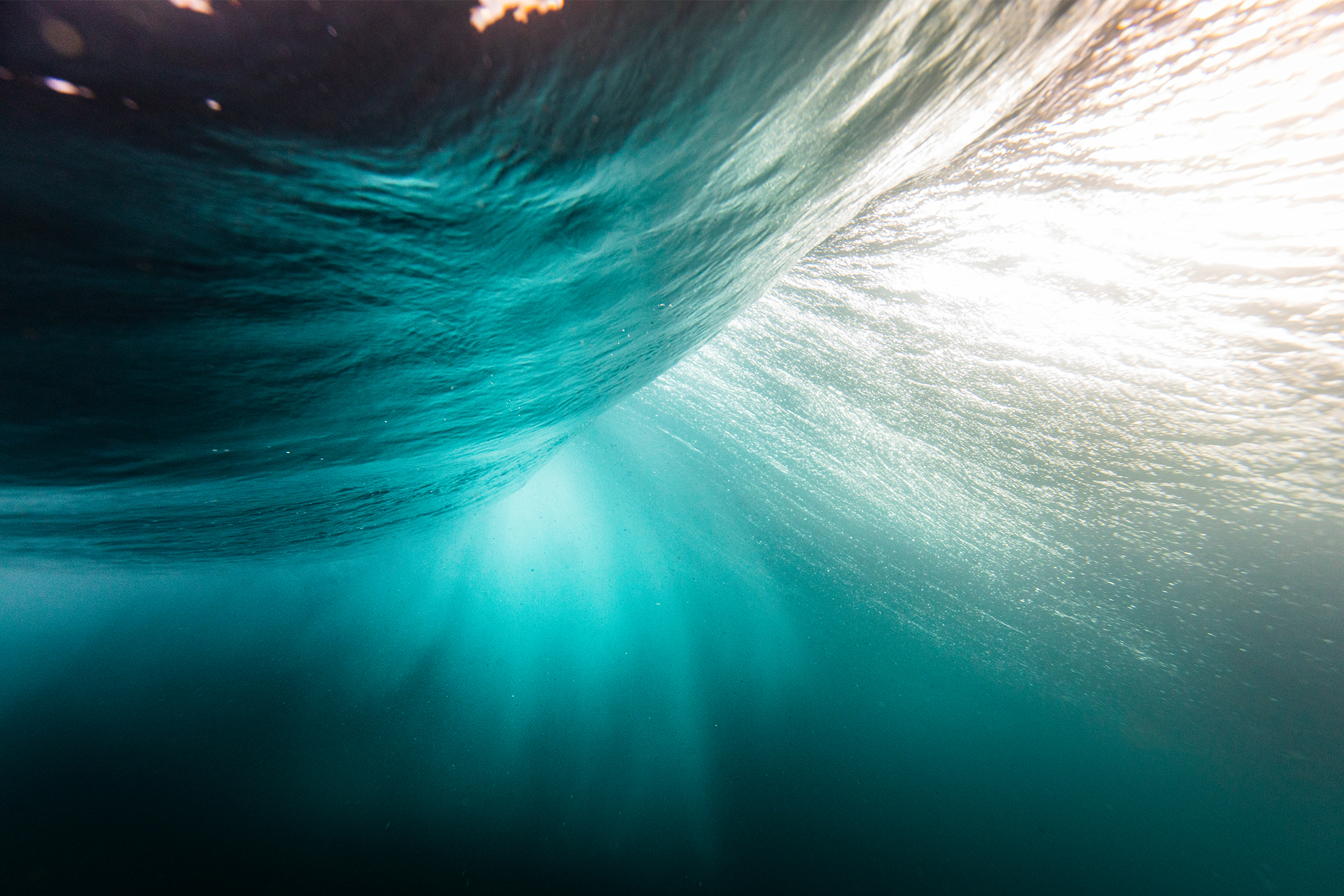 Motion blur of smooth deep blue ocean wave under the waters surface