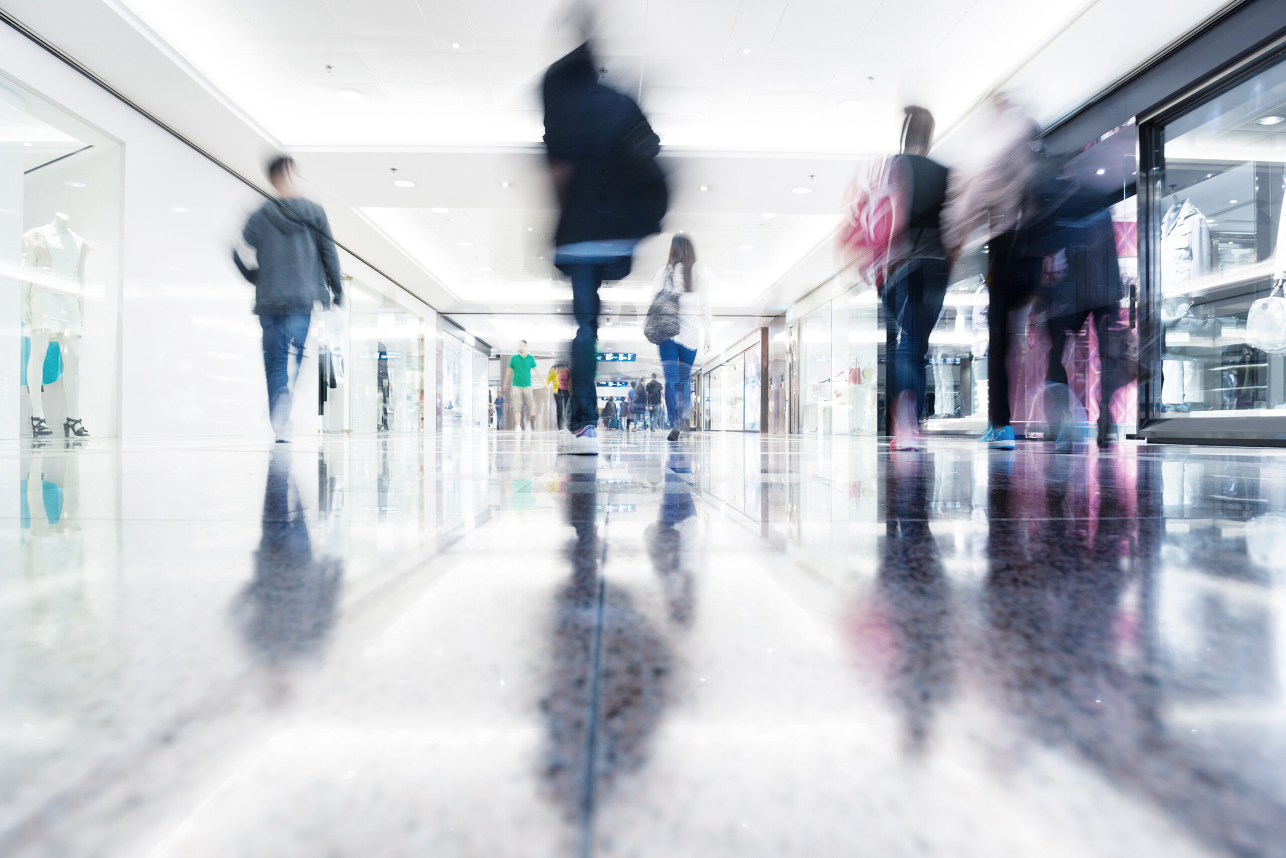 A blurred image of people walking at a mall