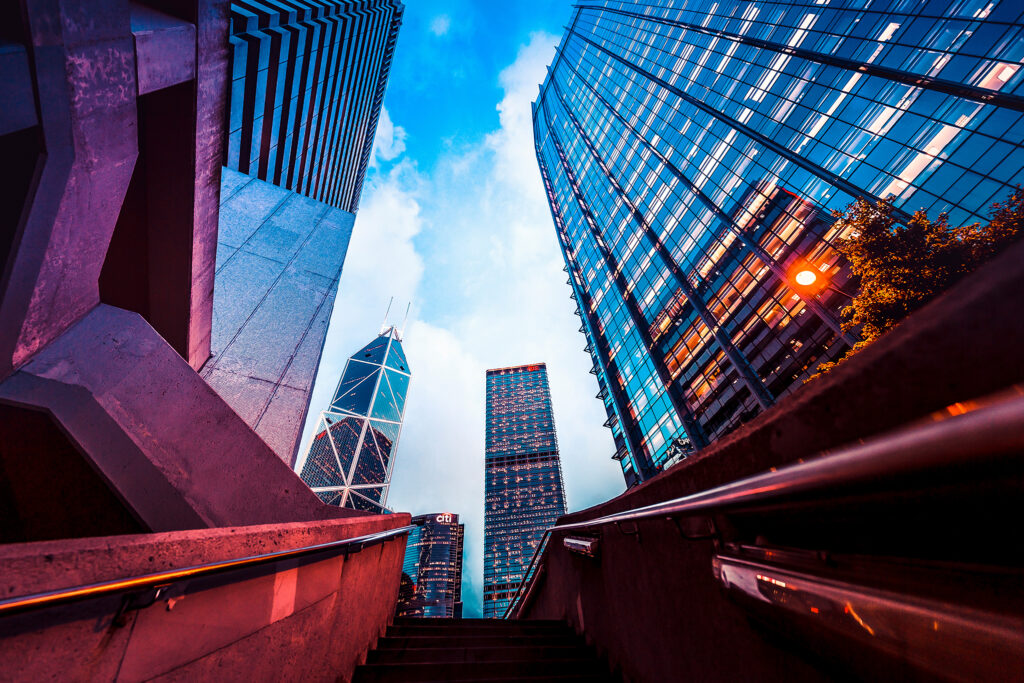 Staircase with glass buildings behind it