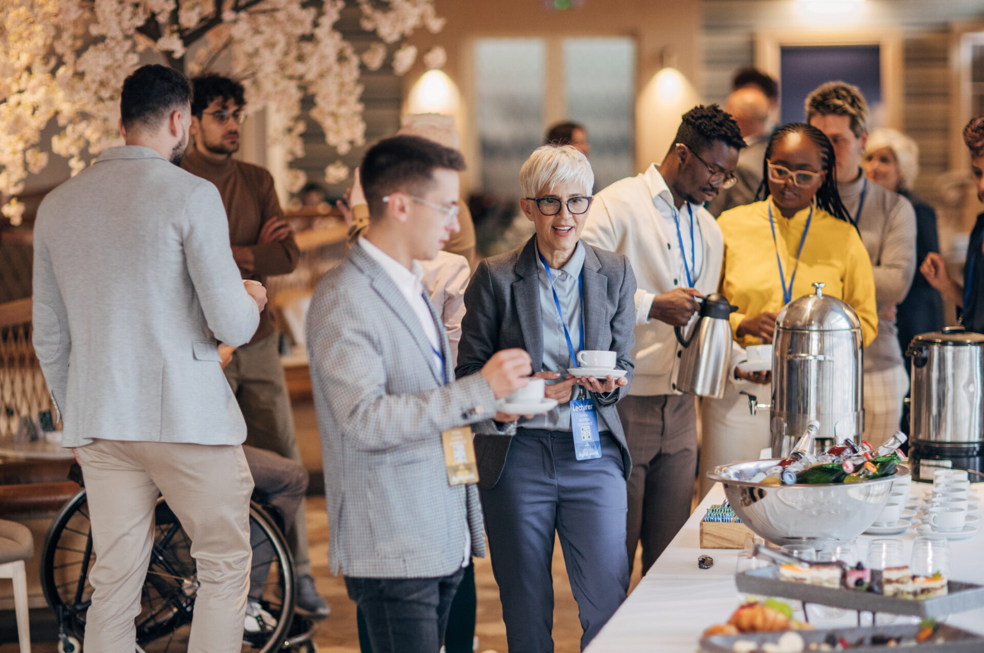 People standing at conference buffet