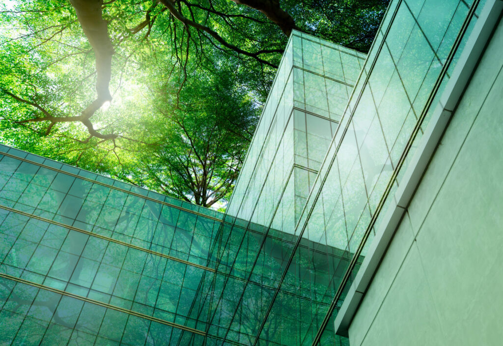 Glass building covered by trees