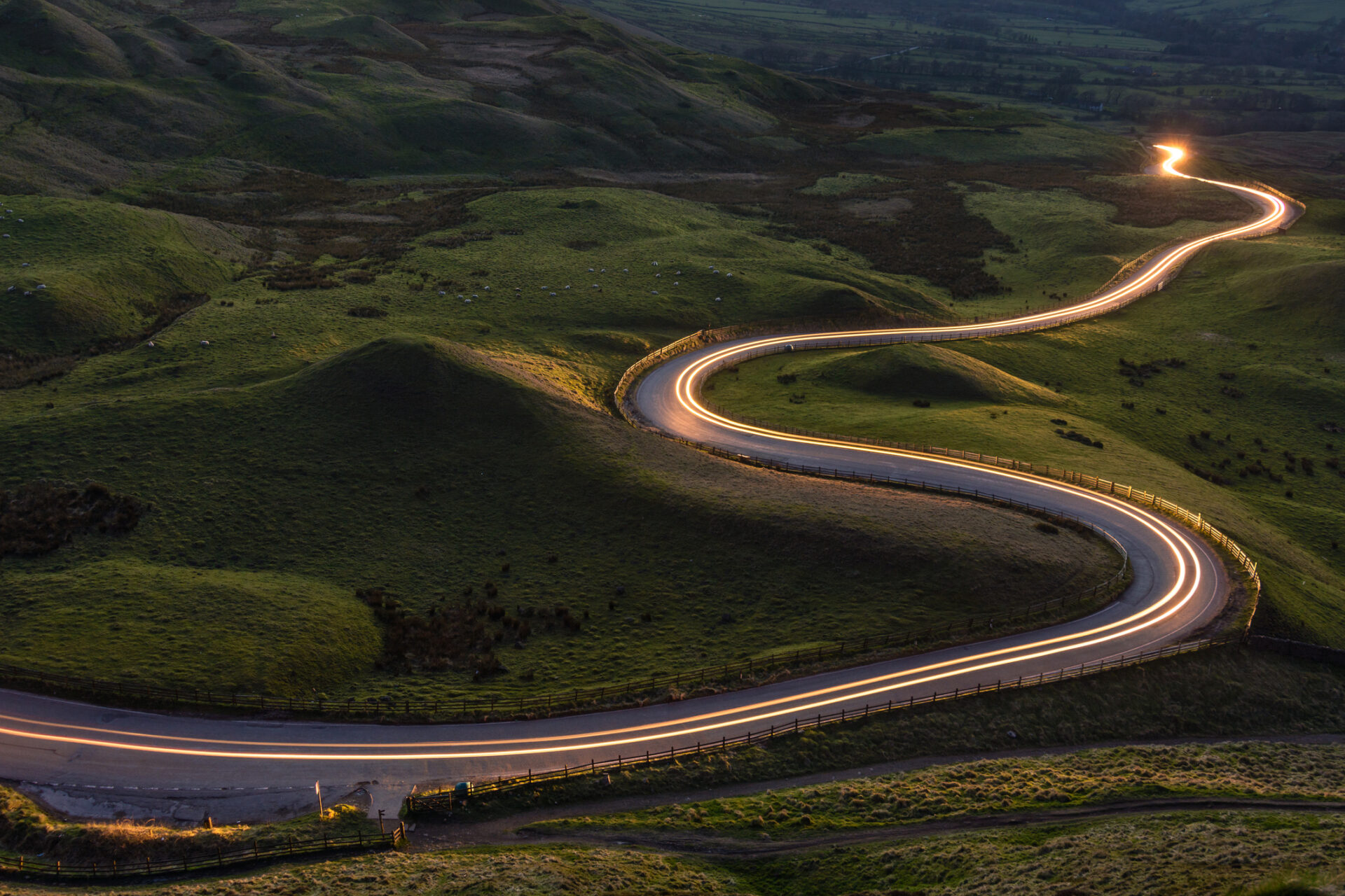 Highway runs through green hills