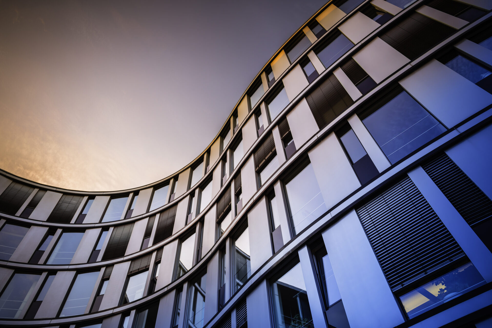 Glass facade of a modern office building in Hamburg, Germany.